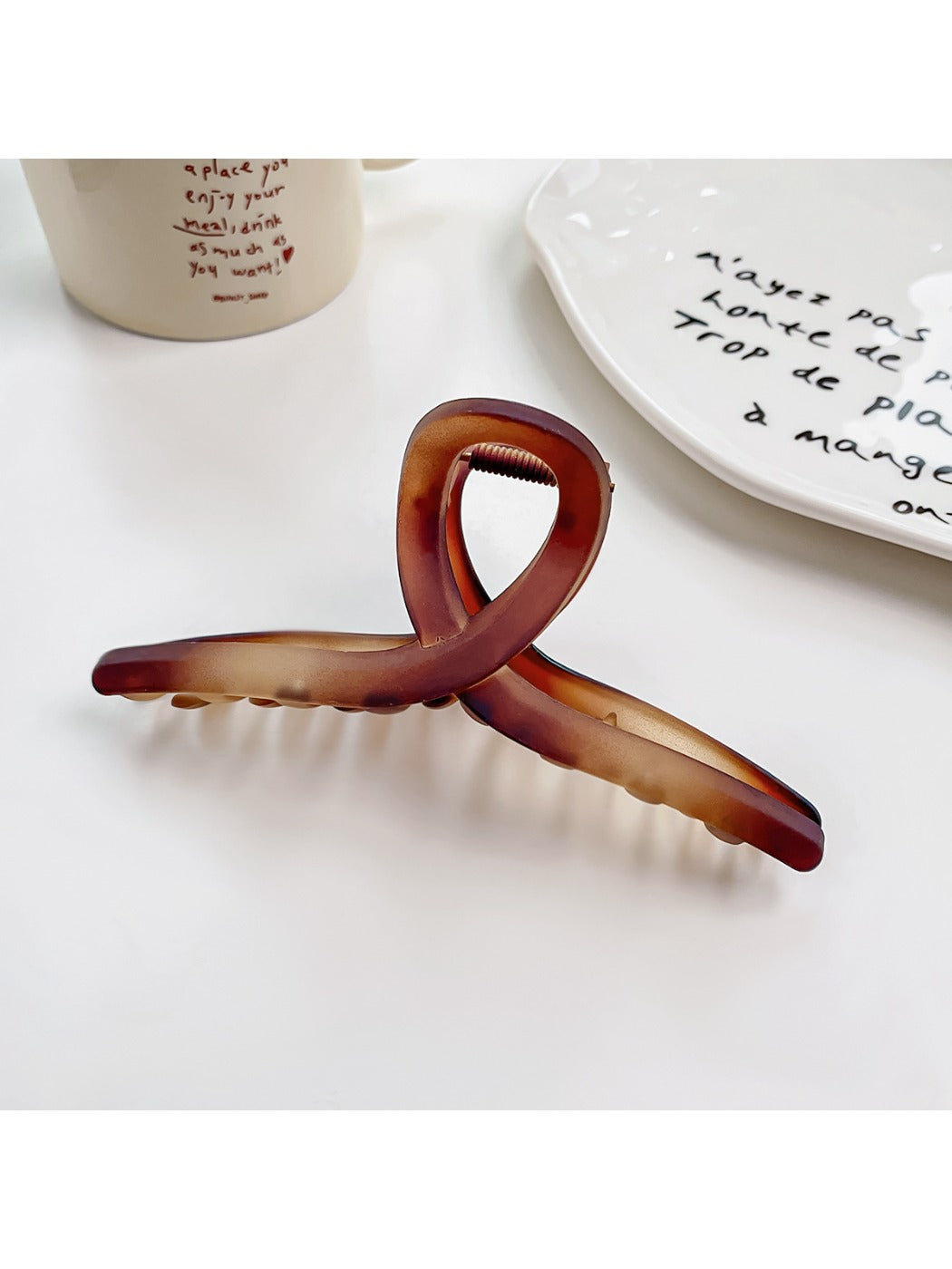 Beau hair claw clip in matte black on a white background