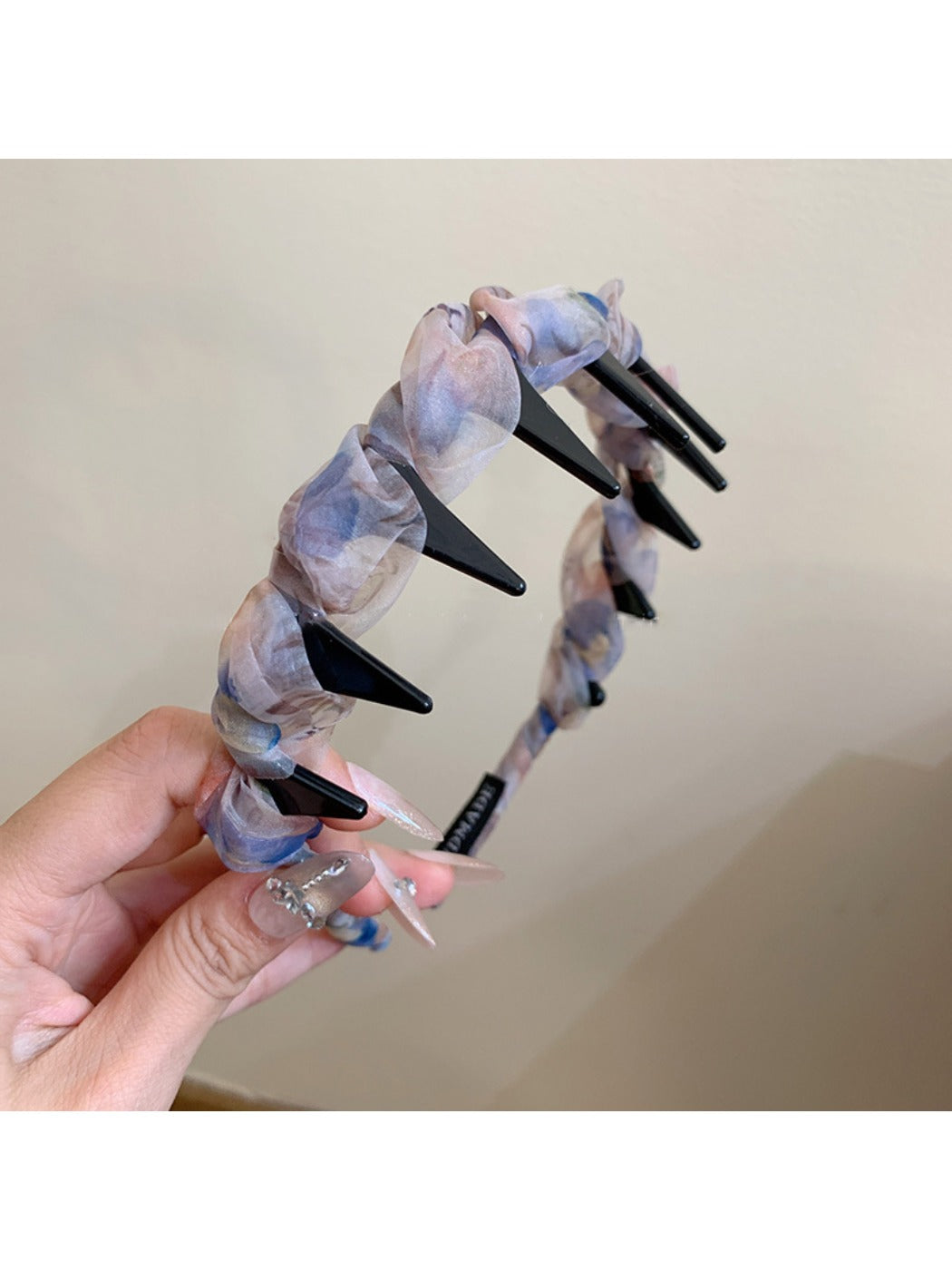 Top view of Gifty floral headband showing symmetrical flower print and smooth finish