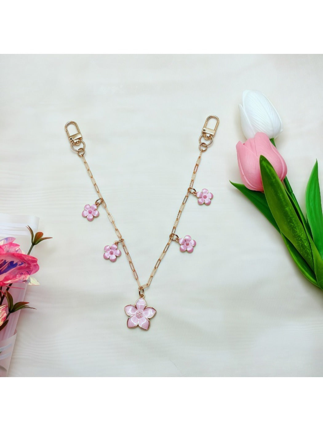 Side view of minimalist cherry blossom pendant highlighting its slim profile and craftsmanship