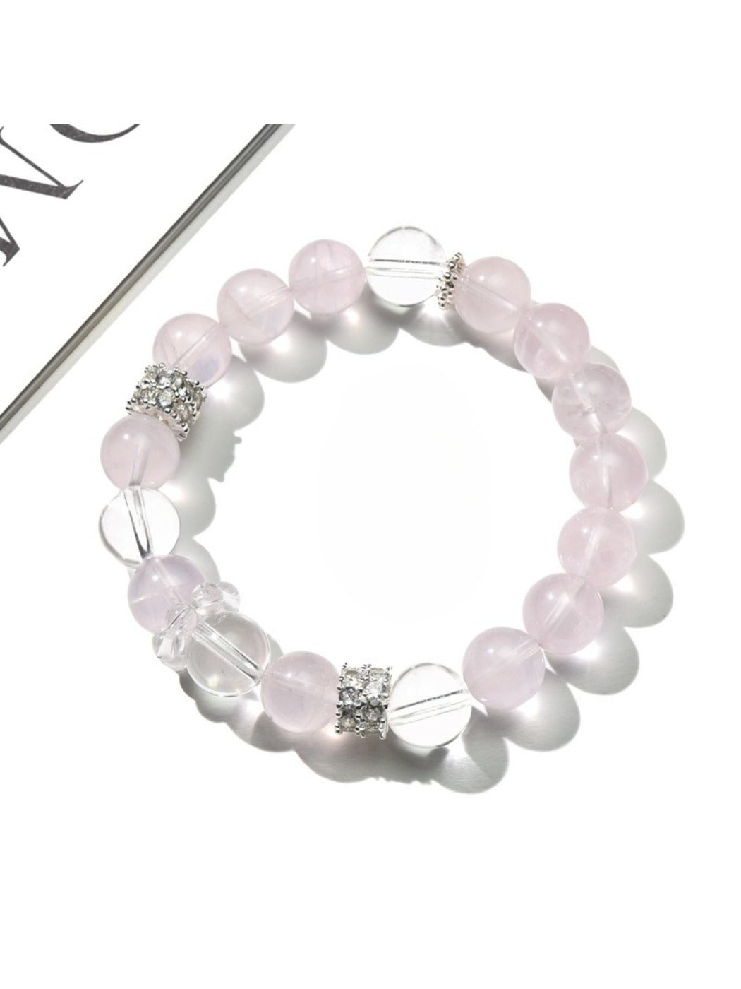 Side view of Lovra pink and white crystal beaded bracelet showing bead details