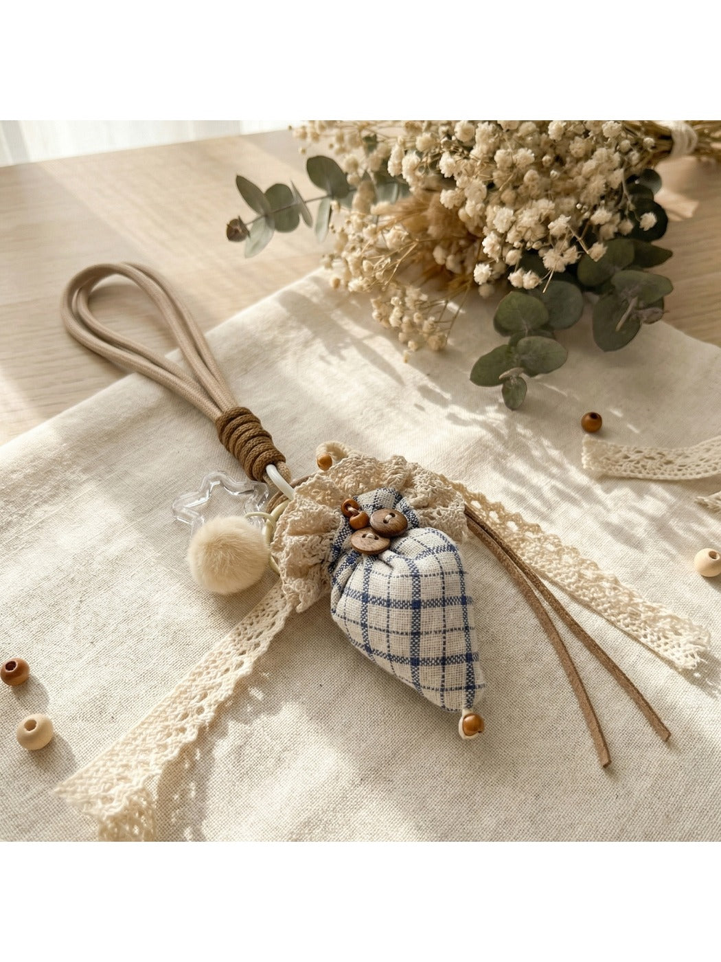 Keychain with strawberry umbrella design attached to a set of keys