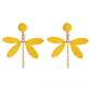 Top view of raffia dragonfly earring highlighting wing design