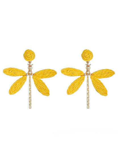 Top view of raffia dragonfly earring highlighting wing design