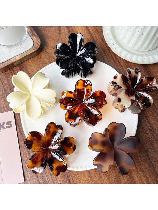 Beau leopard print flower shaped claw clip on white background