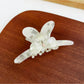 Top view of Beau minimalist bow hair claw clip showing symmetrical design