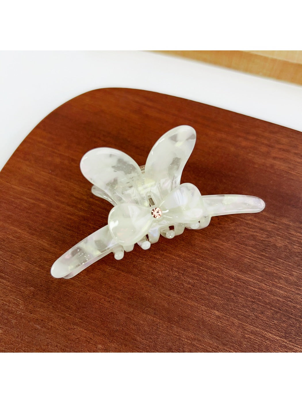 Top view of Beau minimalist bow hair claw clip showing symmetrical design