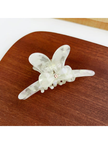 Top view of Beau minimalist bow hair claw clip showing symmetrical design
