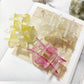 Beau Sweet Acetate Medium Flower Claw Clip held in hand showing size and detail