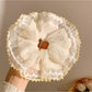 Gifty ruched scrunchie displayed on a white background showing texture