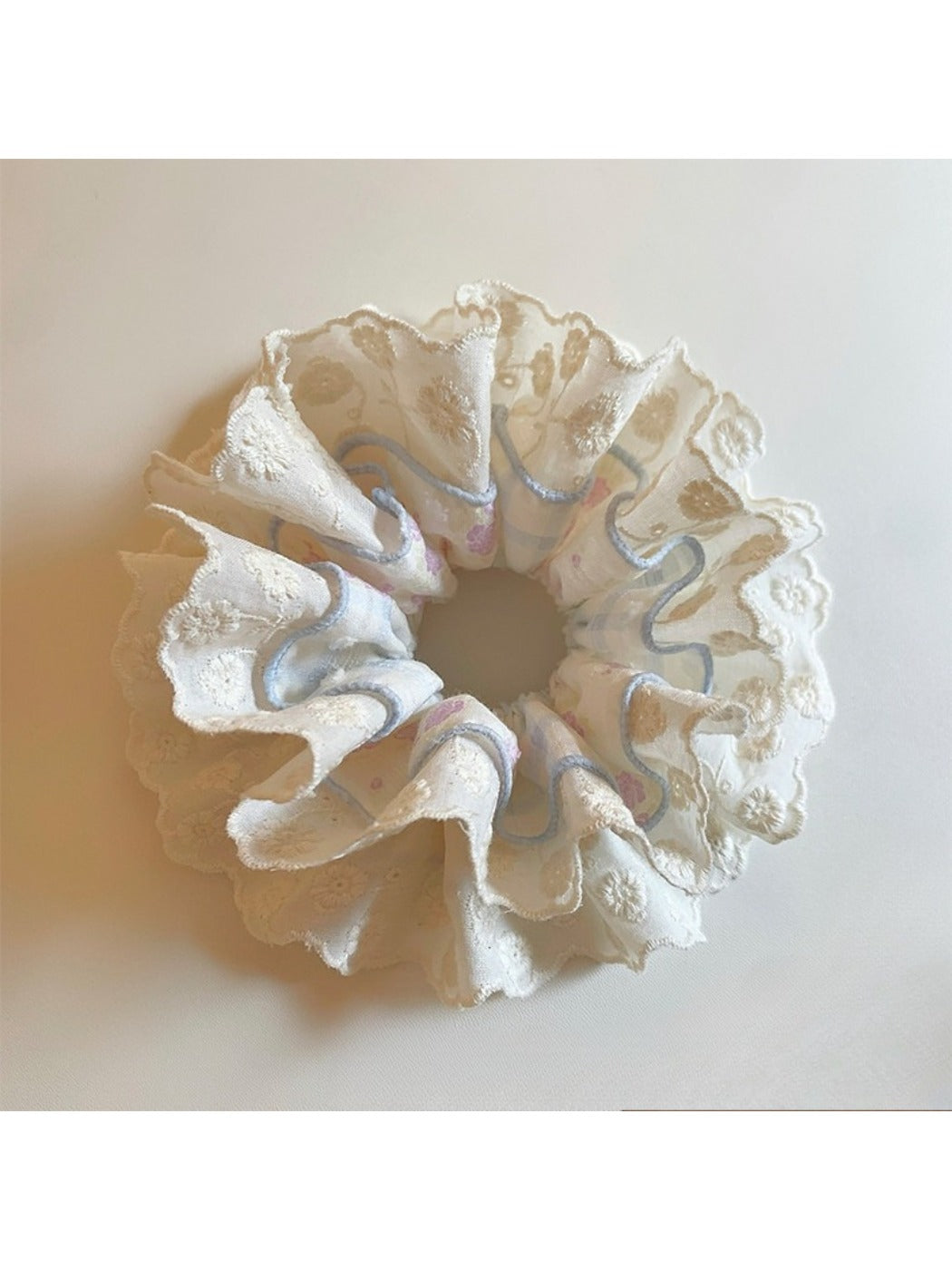 Blue lace double scrunchie displayed on a white background