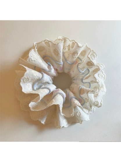 Blue lace double scrunchie displayed on a white background