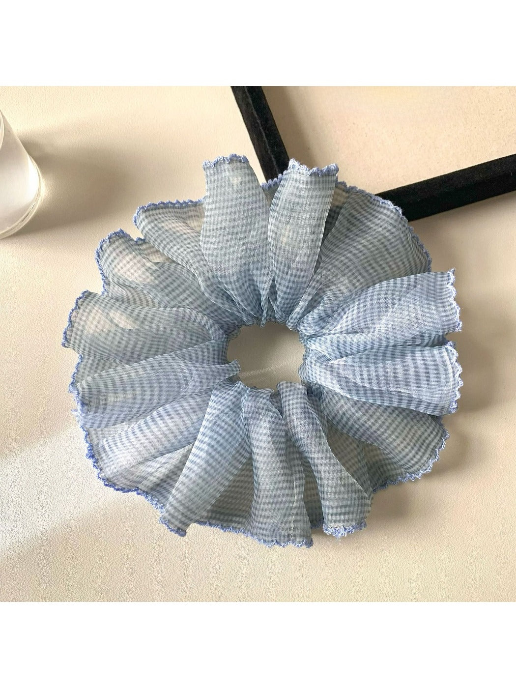 Scrunchies arranged in a circle highlighting their soft fabric and prints