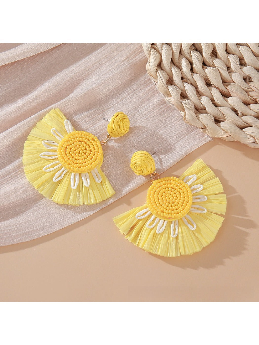 Earedge fan shaped drop earrings worn on a model's ear