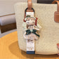 Keypus cute girl charm keychain displayed on a white background