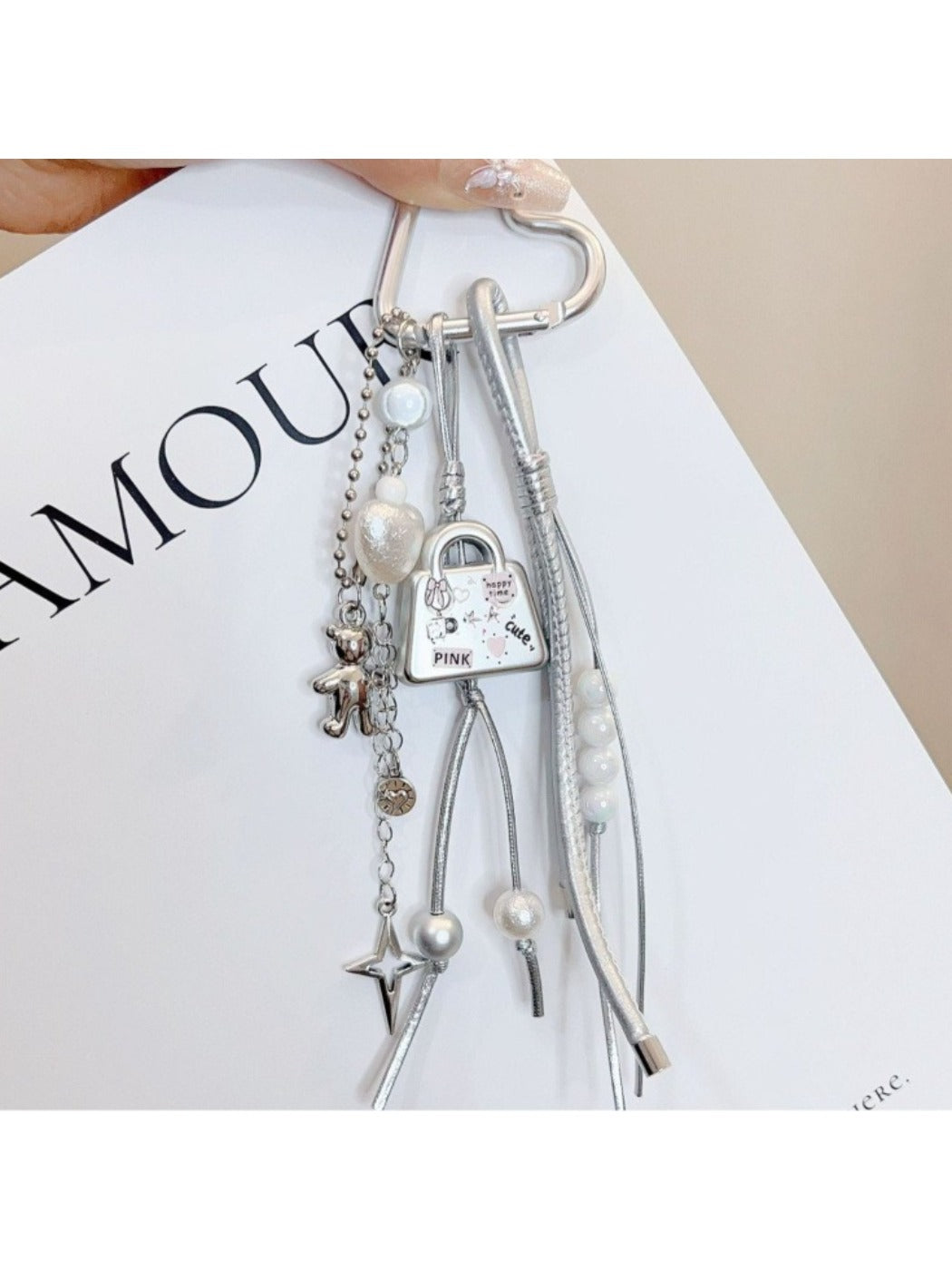 Close-up of Keypus bag charm keychain showing detailed character face and keyring