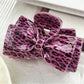 Model wearing Beau classic leopard print bow claw clip in long hair