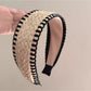 Bohemian wide minimalist headband in neutral tones displayed on a white background