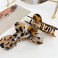 Side view of Beau delicate bow hair claw clip highlighting curved clasp