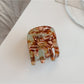 Beau acetate hair clip shown from angled perspective to showcase shape and finish