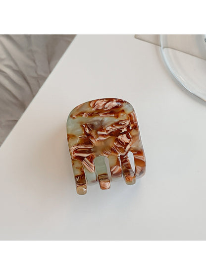 Beau acetate hair clip shown from angled perspective to showcase shape and finish