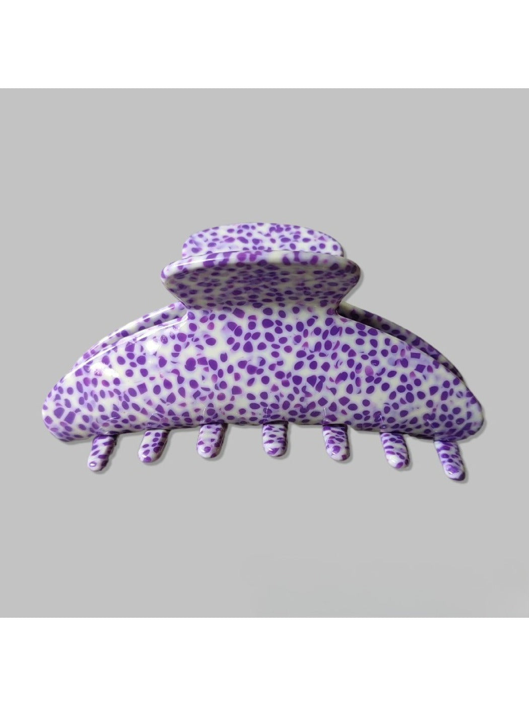 Beau Irregular Polka Dot Claw Clip resting on a white surface