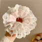 Gifty printed scrunchie in soft pastel colors with floral design close-up