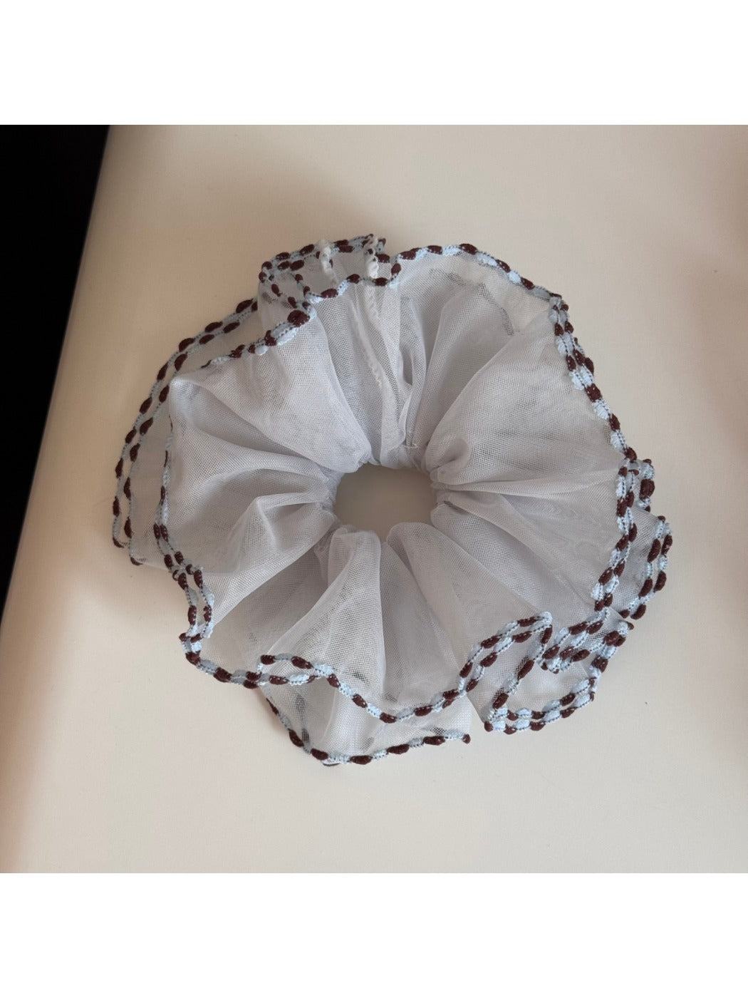 Top view of Gifty color block tulle scrunchie highlighting bound edges and colors