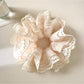 Gifty Sweet Bow Print Ruffled Scrunchie displayed on a white background showing ruffled texture