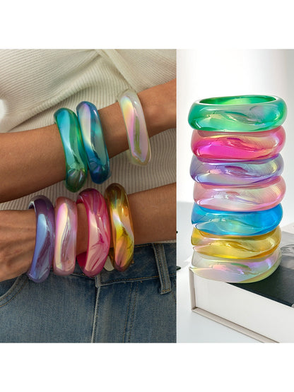 Lovra bangle bracelet worn on wrist with colorful abstract design