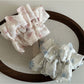 Side view of Gifty Sweet Lace Tiny Floral Scrunchie highlighting lace details and floral print