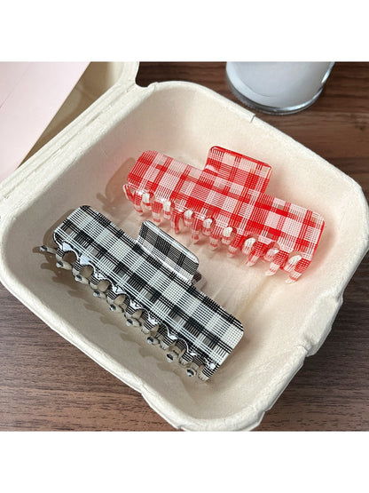 Beau plaid updo claw clip holding hair in an elegant updo style