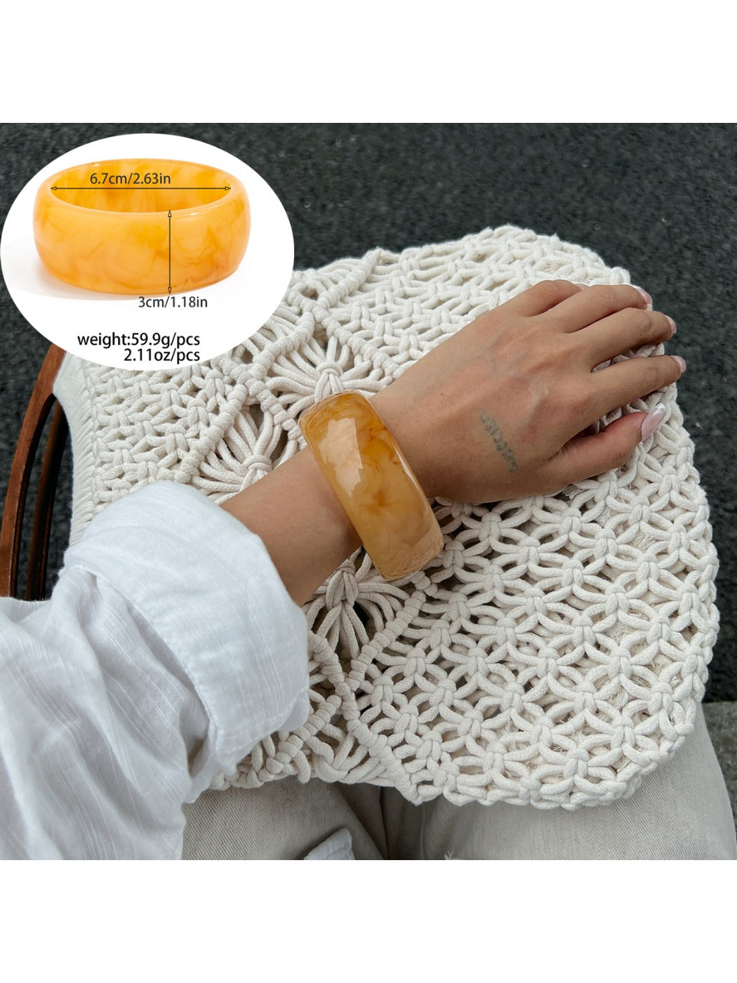 Lovra bracelet styled with casual outfit on model's arm