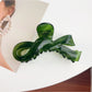 Top view of Beau bow shaped hair claw clip showing symmetrical design