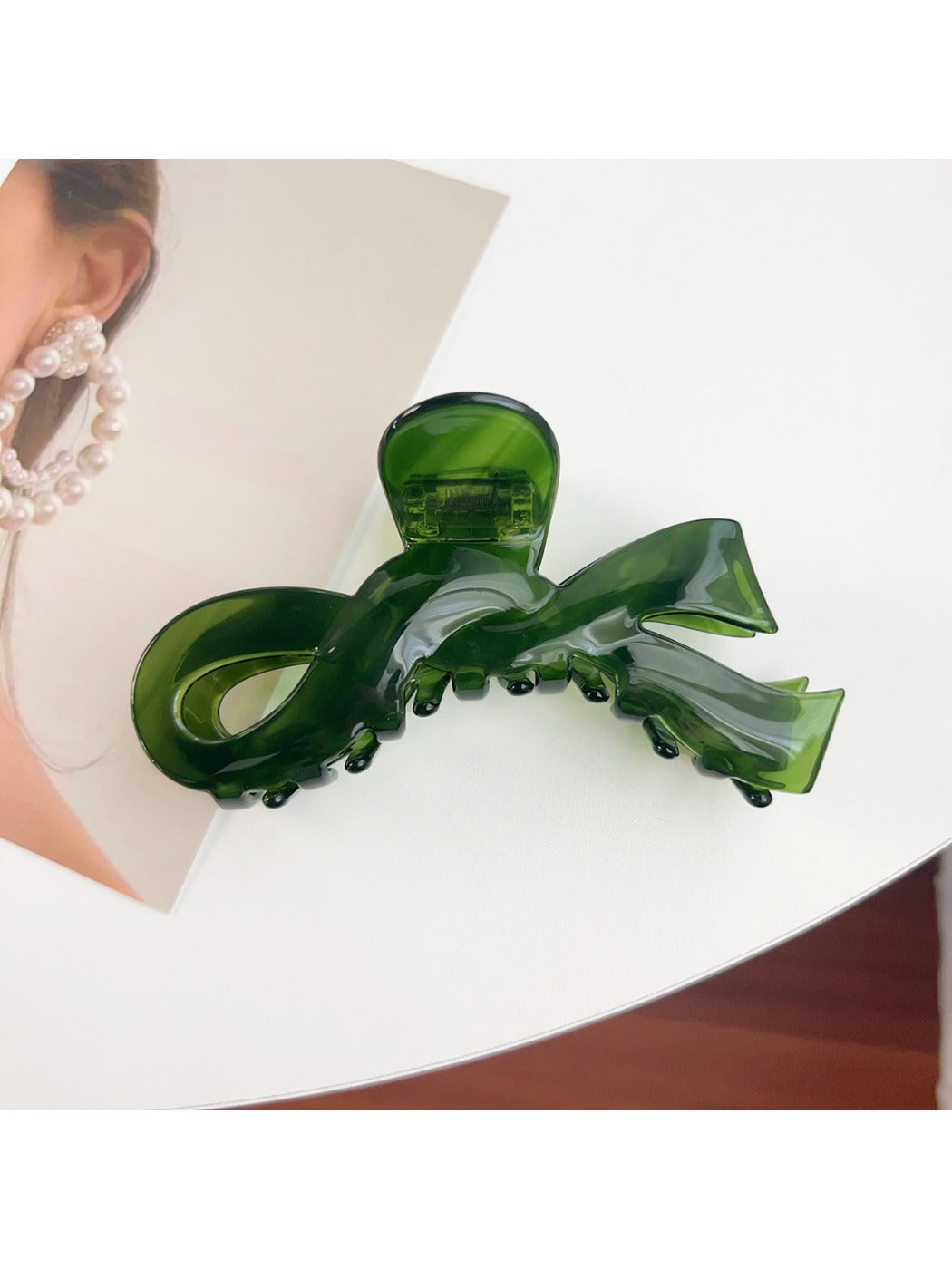 Top view of Beau bow shaped hair claw clip showing symmetrical design