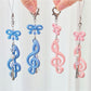 Close-up of Keypus cute music note keychain on a white background