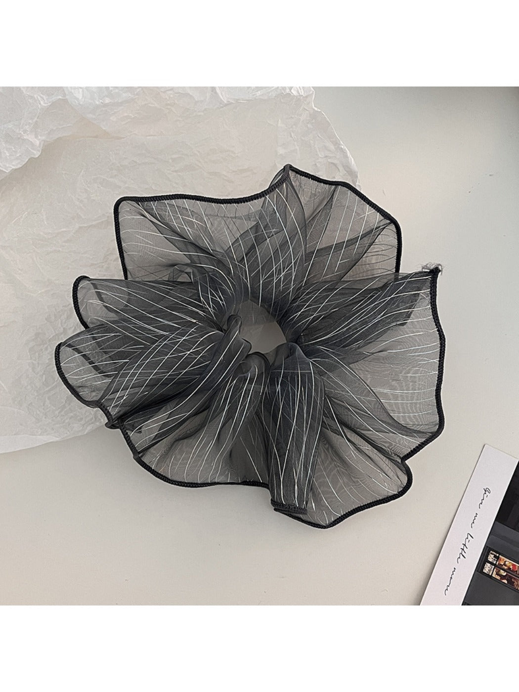 Side view of Gifty minimalist scrunchie showing pleated fabric texture