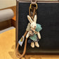 Close-up of keyring and clasp connected to the rabbit charm