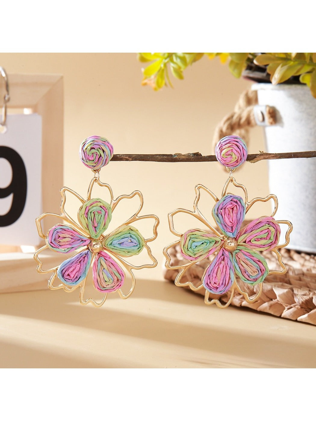 Pair of Earedge flower shaped drop earrings with detailed floral pattern
