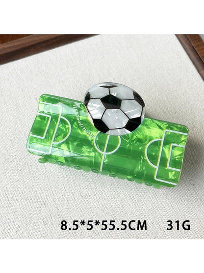 Beau claw clip with soccer ball design displayed on a white background
