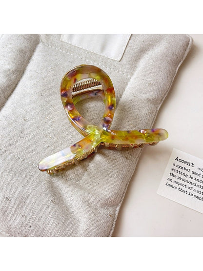 Beau vintage crisscross hair claw clip displayed on a white background