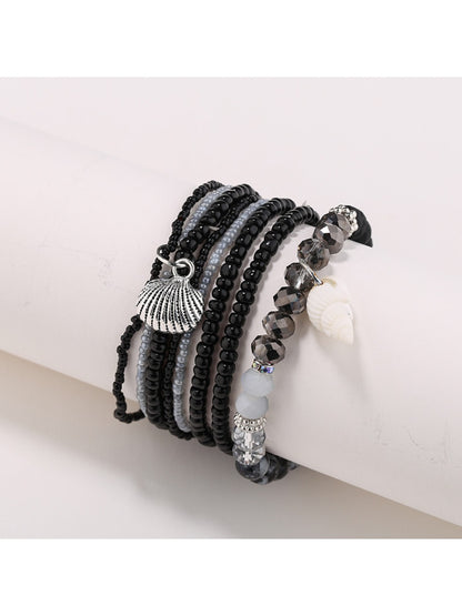 Lovra bracelet with gold and neutral beads styled with casual outfit