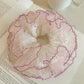 Gifty tulle scrunchie with multicolored polka dots displayed flat