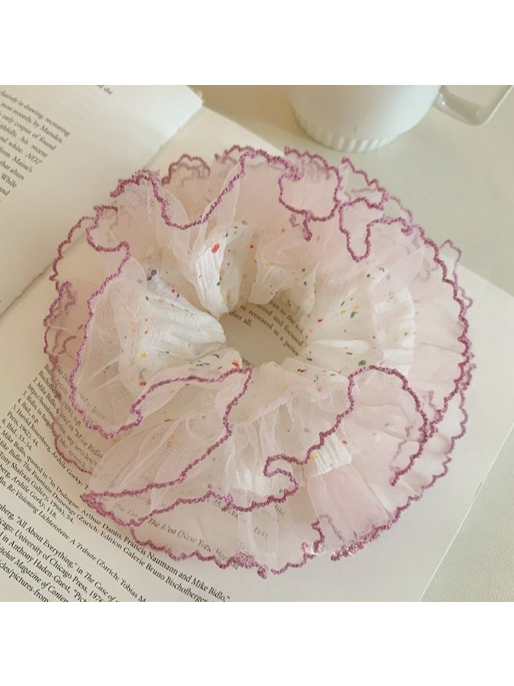Gifty tulle scrunchie with multicolored polka dots displayed flat