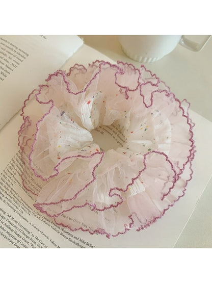 Gifty tulle scrunchie with multicolored polka dots displayed flat