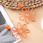 Detailed shot of the openwork floral pattern on Earedge drop earring
