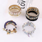 Lovra vintage layered beaded bracelet displayed on a wooden surface