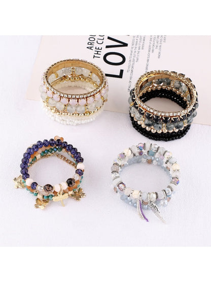 Lovra vintage layered beaded bracelet displayed on a wooden surface