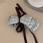 Beau delicate bow hair clip packaging with branding and product details