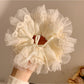 Side view of Gifty minimalist bow scrunchie highlighting bow shape