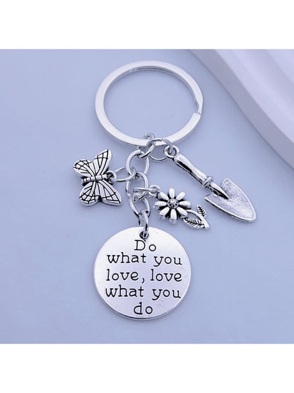 Close-up of butterfly flower keychain showing detailed petal texture and metal ring